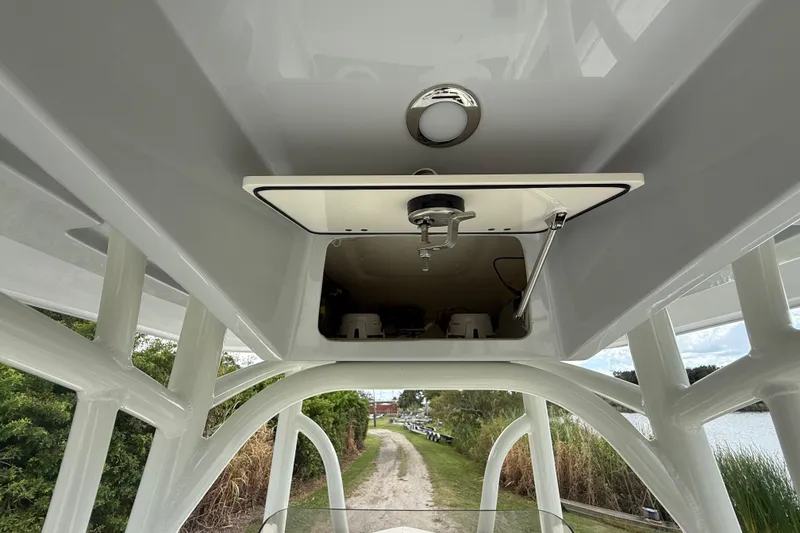 Slide: The Image of 2025 Pathfinder 2400 TRS boat interior, featuring a storage compartment and sleek design. - 40