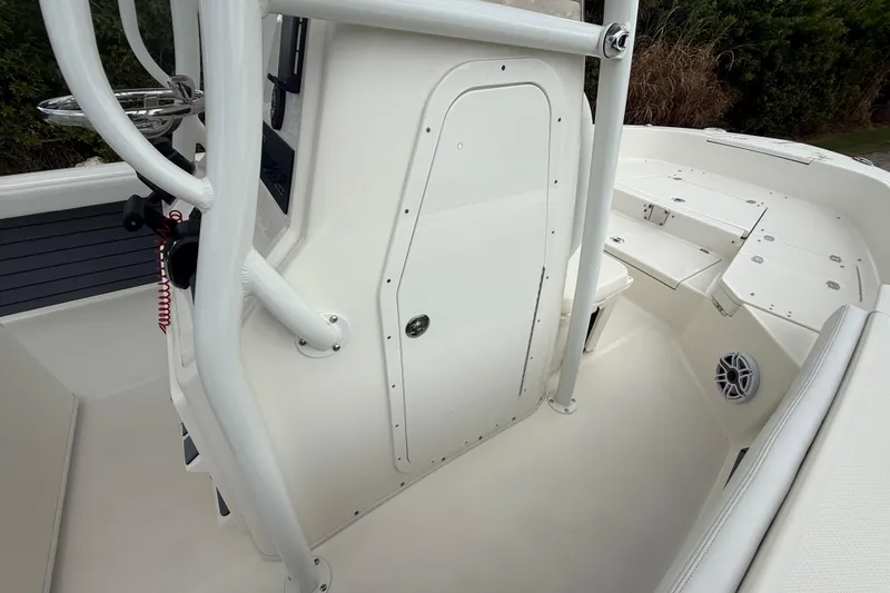 Slide: The Image of 2025 Pathfinder 2400 TRS boat interior, featuring sleek white design and modern amenities. - 43