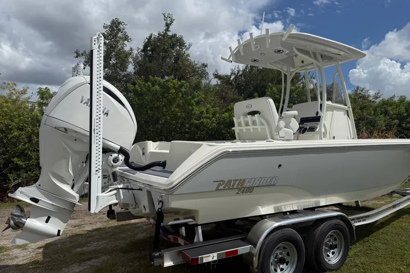 Slide: The Image of 2025 Pathfinder 2400 TRS boat on trailer, featuring Yamaha outboard motor. - 7