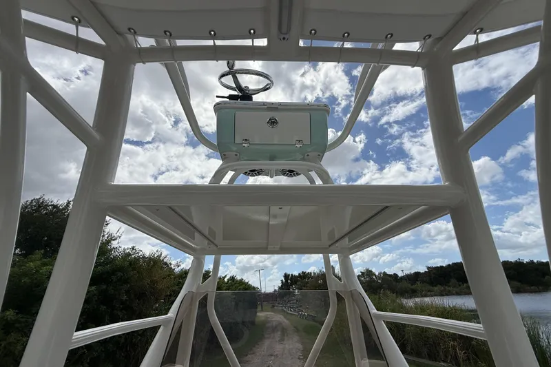 Slide: The Image of 2025 Pathfinder 2400 Open boat interior with steering wheel, viewed from below. - 17
