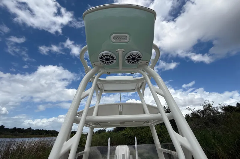 Slide: The Image of 2025 Pathfinder 2400 Open boat tower with speakers against a cloudy sky. - 23