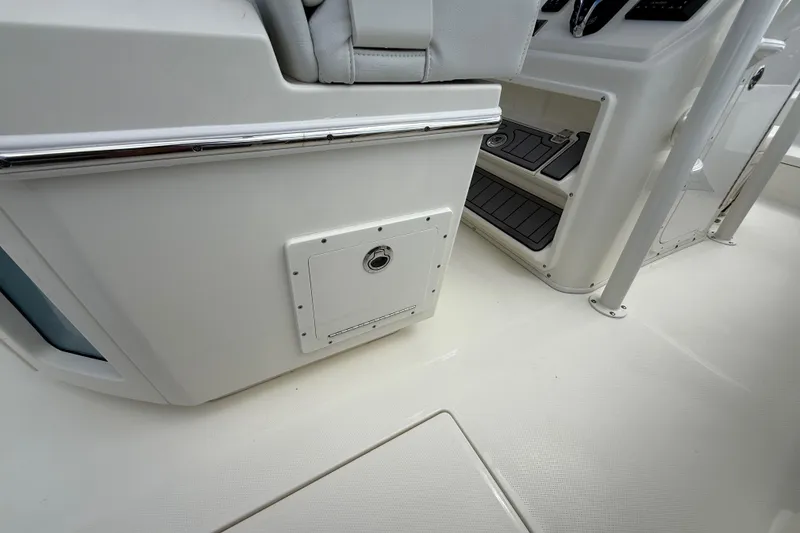 Slide: The Image of Interior view of 2025 Pathfinder 2400 Open boat, featuring sleek design and storage compartment. - 36