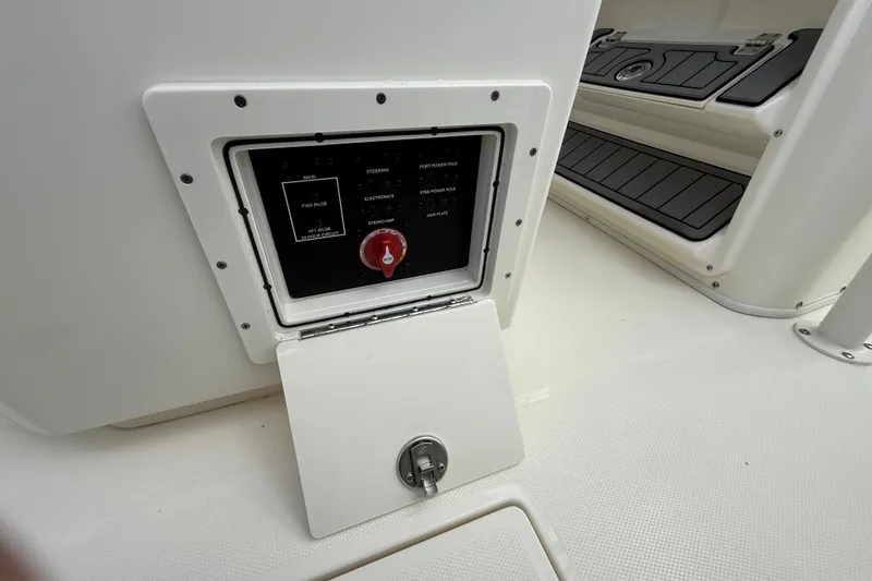 Slide: The Image of 2025 Pathfinder 2400 Open boat control panel with open access hatch. - 37