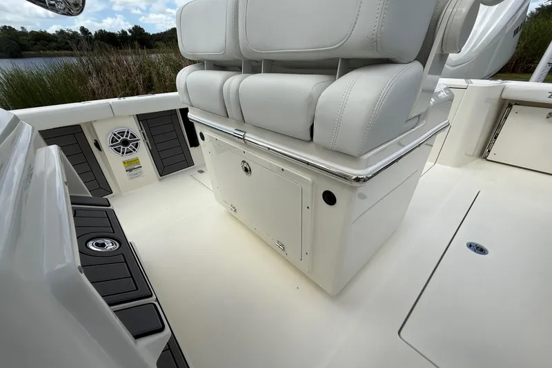 Slide: The Image of 2025 Pathfinder 2400 Open boat interior with white seating and storage compartments. - 40