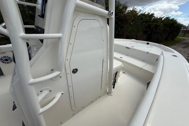 Slide: The Image of 2025 Pathfinder 2400 Open boat interior with sleek white design and storage compartment. - 42