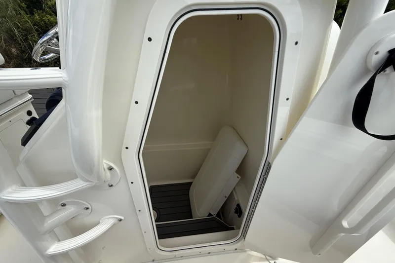 Slide: The Image of 2025 Pathfinder 2400 Open boat interior storage compartment with open door. - 43