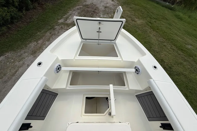 Slide: The Image of 2025 Pathfinder 2400 Open boat interior with open storage compartments and speakers. - 44