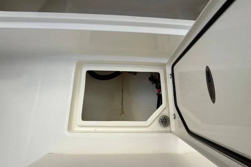Slide: The Image of Open storage compartment on 2025 Pathfinder 2400 Open boat, showcasing interior space. - 45