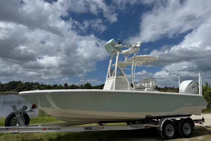 Slide: The Image of 2025 Pathfinder 2400 Open boat on trailer under cloudy sky. - 9