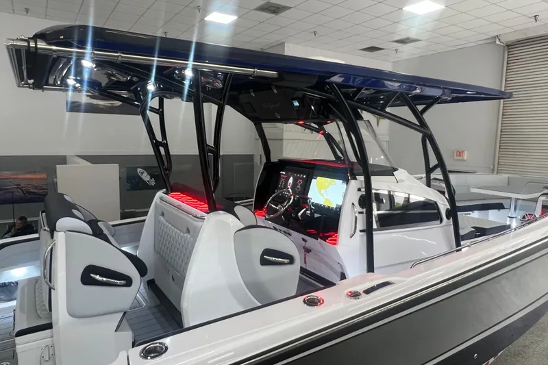 Slide: The Image of 2026 Nor-Tech 390 Sport Center Console boat with advanced navigation system and sleek design. - 14