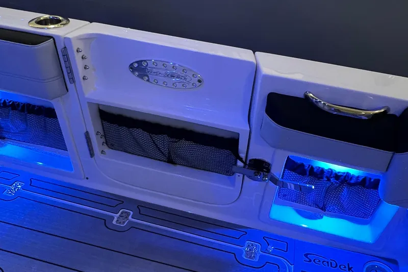 Slide: The Image of 2026 Nor-Tech 390 Sport Center Console with blue LED lighting and storage compartments. - 5