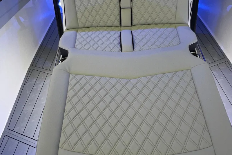 Slide: The Image of Luxurious seating on 2026 Nor-Tech 390 Sport Center Console with diamond stitching. - 8
