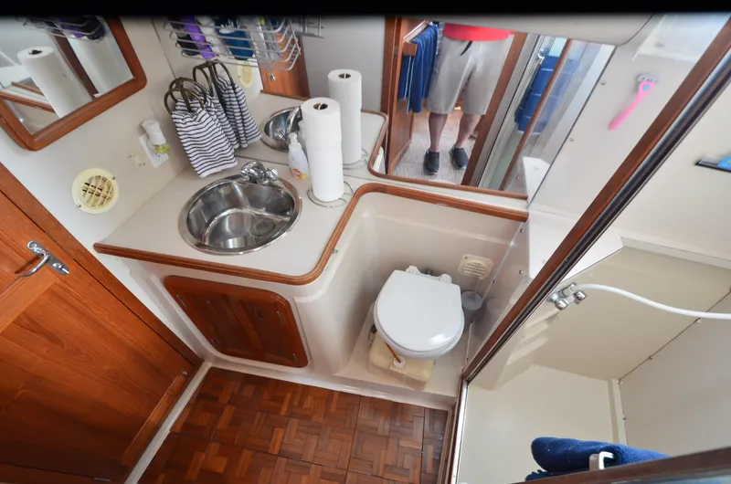 Slide: The Image of 1989 Carver Santego 3867 bathroom with sink, toilet, and shower area. - 23