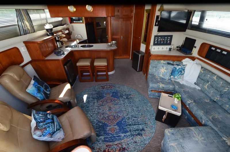 Slide: The Image of Interior of 1989 Carver Santego 3867 yacht with cozy seating and modern amenities. - 25