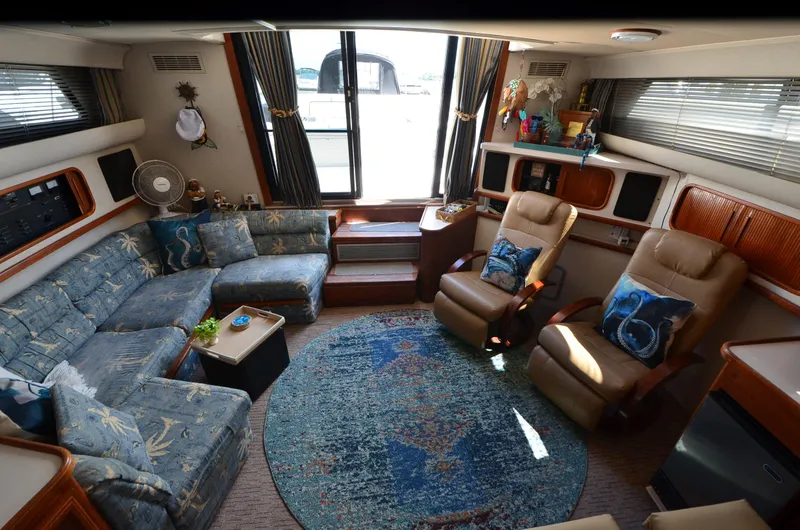 Slide: The Image of Interior of 1989 Carver Santego 3867 yacht with cozy seating and nautical decor. - 27