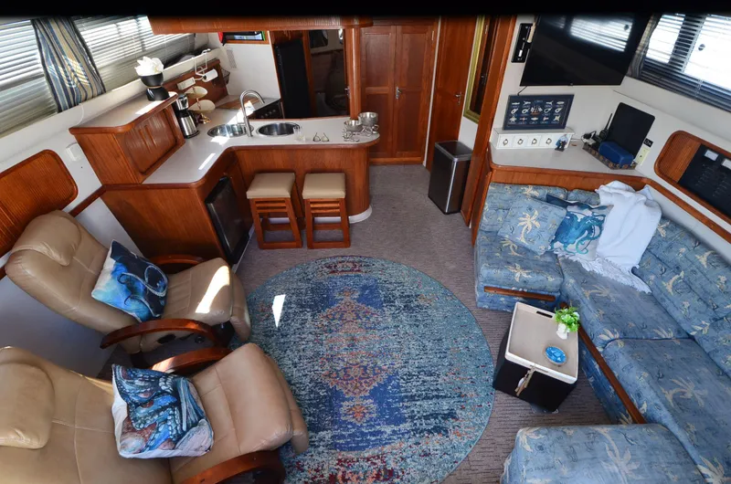 Slide: The Image of Interior of 1989 Carver Santego 3867 yacht with cozy seating and modern amenities. - 30