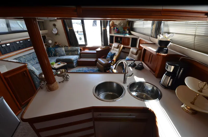 Slide: The Image of Interior of 1989 Carver Santego 3867 yacht with kitchen and seating area. - 33