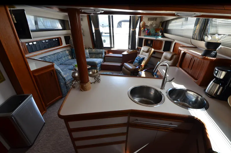 Slide: The Image of Interior of 1989 Carver Santego 3867 yacht with kitchen and lounge area. - 35