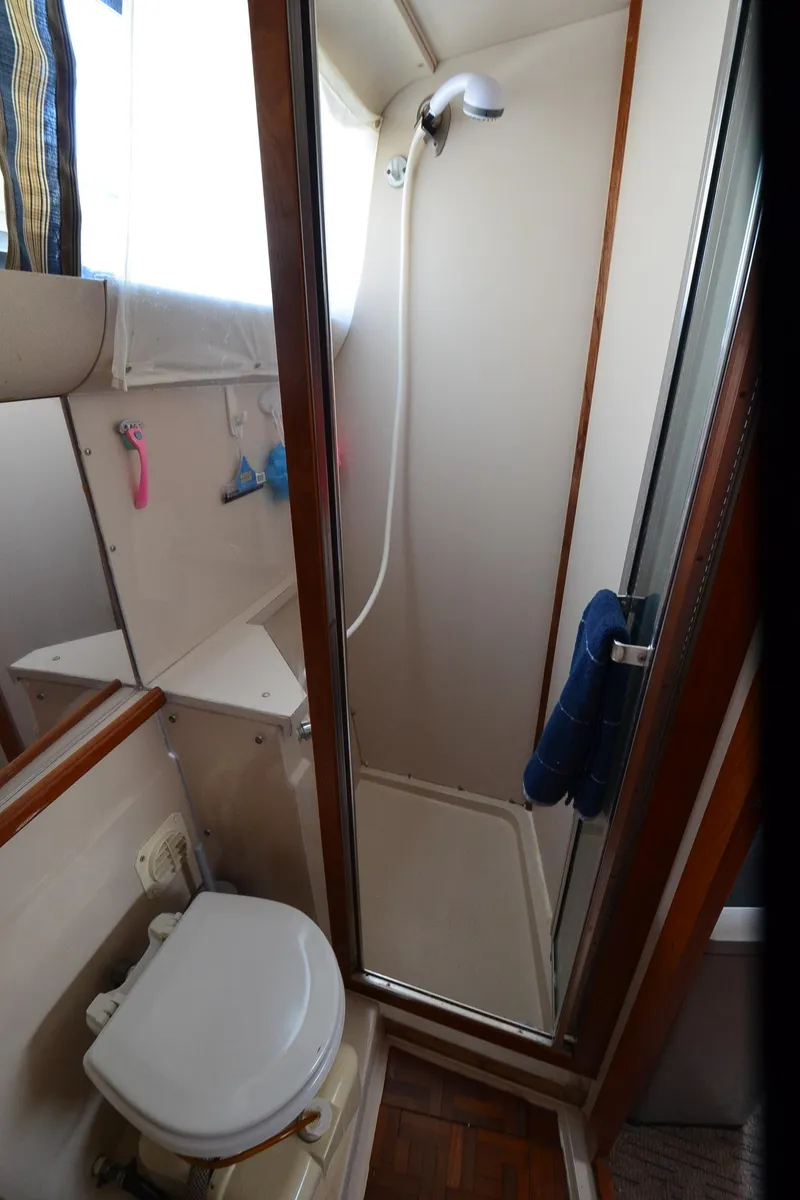 Slide: The Image of 1989 Carver Santego 3867 bathroom with shower and toilet, compact marine design. - 37