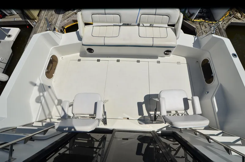 Slide: The Image of 1989 Carver Santego 3867 yacht deck with seating and railing, docked at marina. - 6