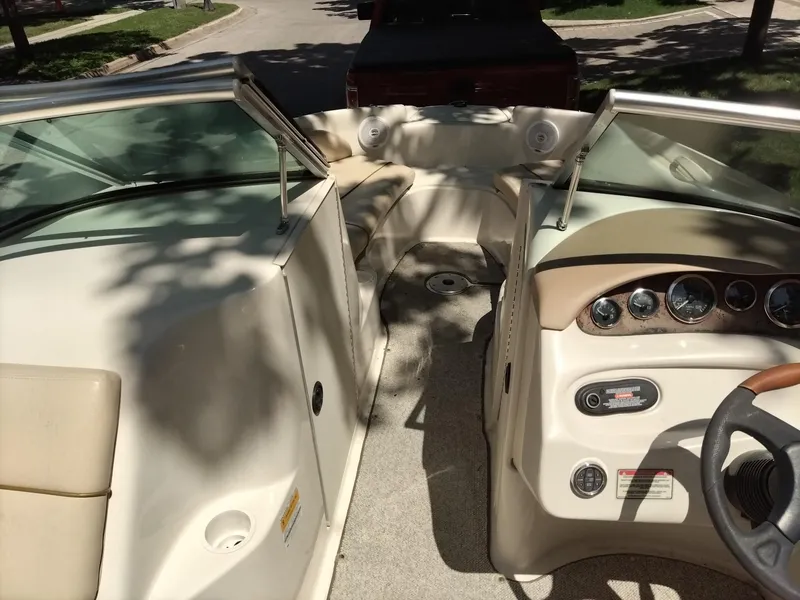 Slide: The Image of 2001 Sea Ray 190 Bow Rider interior with dashboard and seating area. - 5