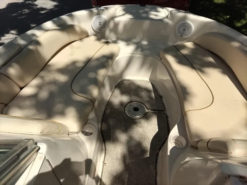 Slide: The Image of 2001 Sea Ray 190 Bow Rider interior with beige seating and carpeted floor. - 6