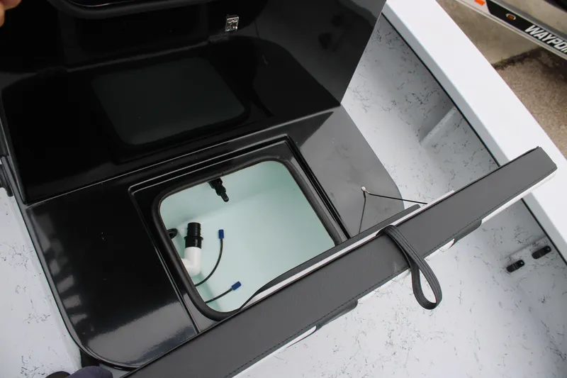 Slide: The Image of Open storage compartment on 2025 Freedom Boats 23' Warrior, showcasing interior details. - 10