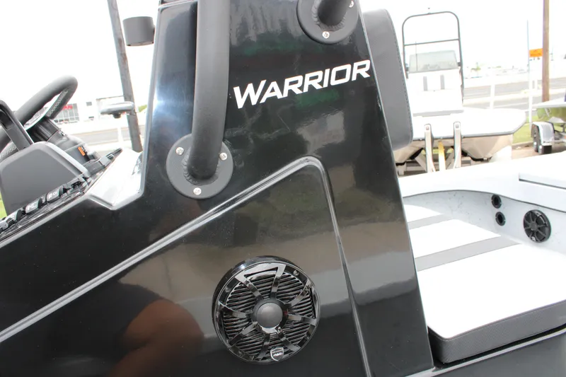 Slide: The Image of 2025 Freedom Boats 23' Warrior console with speaker and steering wheel detail. - 12