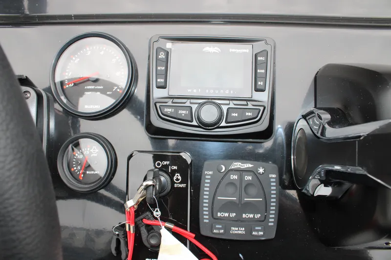 Slide: The Image of Dashboard of 2025 Freedom Boats 23' Warrior with gauges and controls. - 18