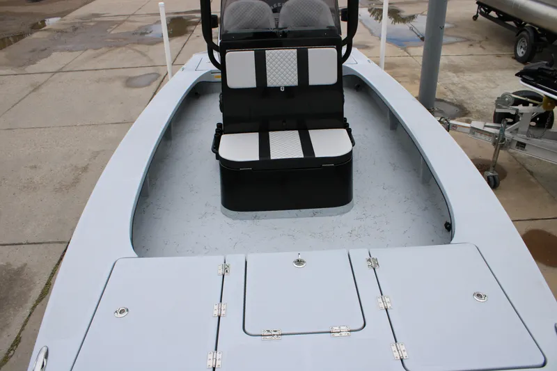 Slide: The Image of 2025 Freedom Boats 23' Warrior deck with seating and storage compartments. - 28