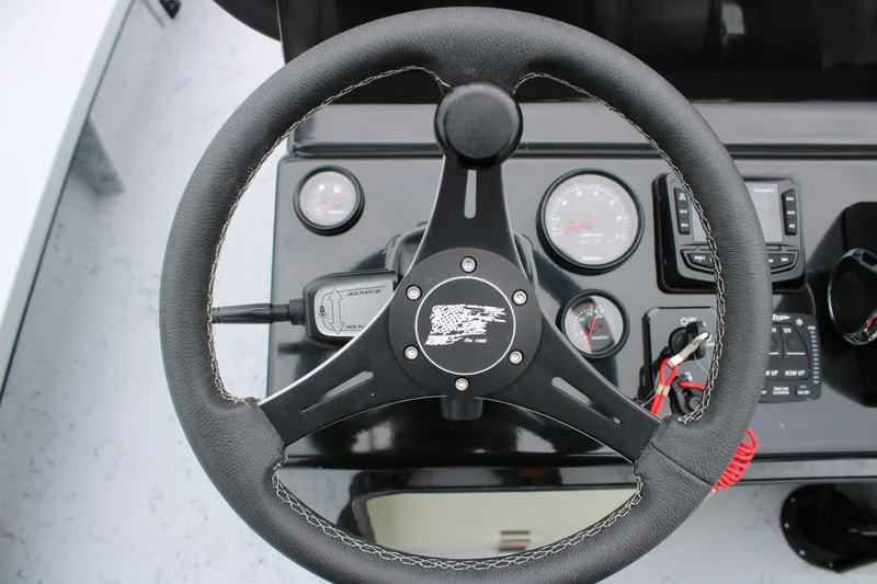 Slide: The Image of Steering wheel and dashboard of 2025 Freedom Boats 23' Warrior. - 20