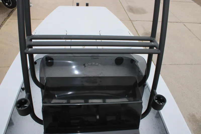 Slide: The Image of 2025 Freedom Boats 23' Warrior deck with black console and rod holders. - 21