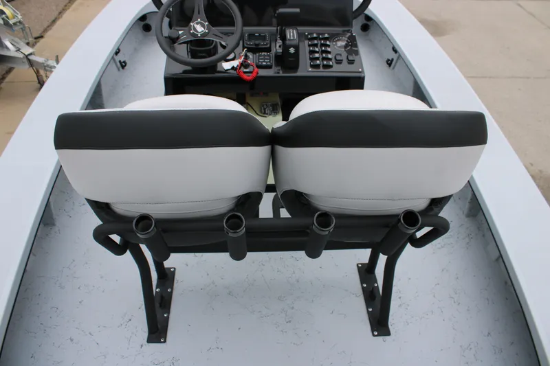 Slide: The Image of 2025 Freedom Boats 23' Warrior interior with dual seats and steering console. - 7