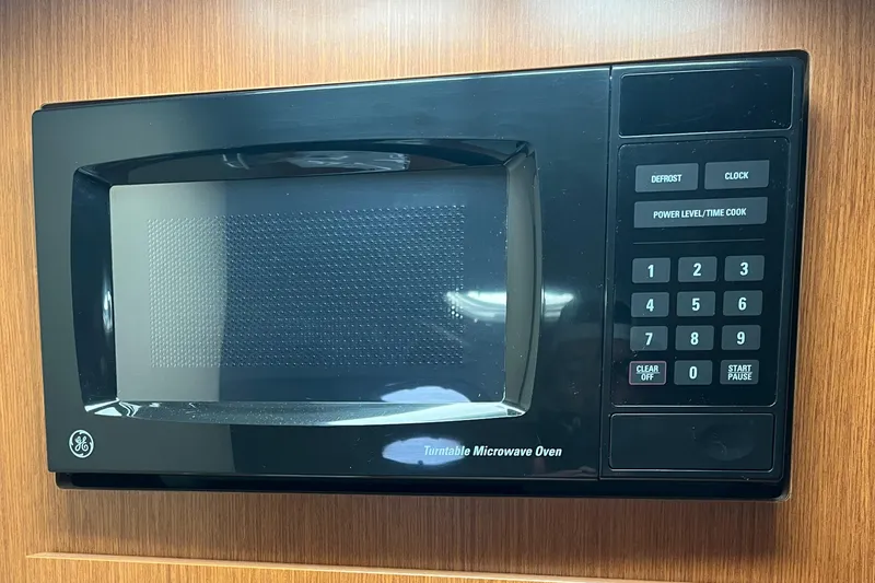 Slide: The Image of GE turntable microwave oven in a 2004 Cruisers Yachts 320 Express. - 27