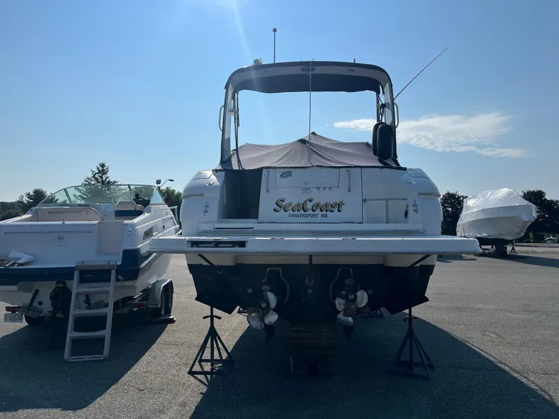 Slide: The Image of 2004 Cruisers Yachts 320 Express on stands, rear view, sunny day. - 7