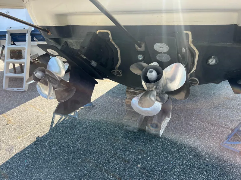 Slide: The Image of 2004 Cruisers Yachts 320 Express propellers and stern view in sunlight. - 8