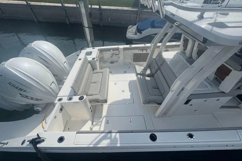 Slide: The Image of 2024 Pursuit S 358 Sport boat with dual engines and spacious seating area. - 4