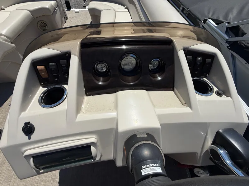 Slide: The Image of Dashboard of a 2016 Bennington 22 SX boat with gauges and controls. - 8