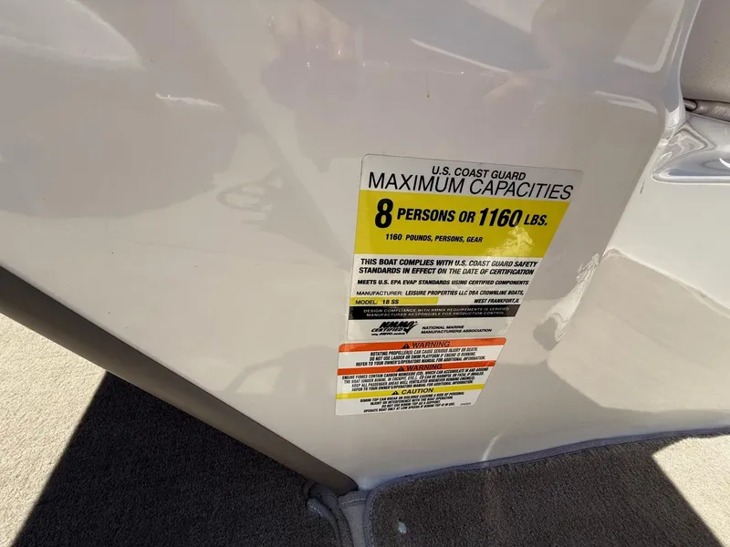 Slide: The Image of Capacity label on 2012 Crownline 18 SS boat, max 8 persons or 1160 lbs. - 13