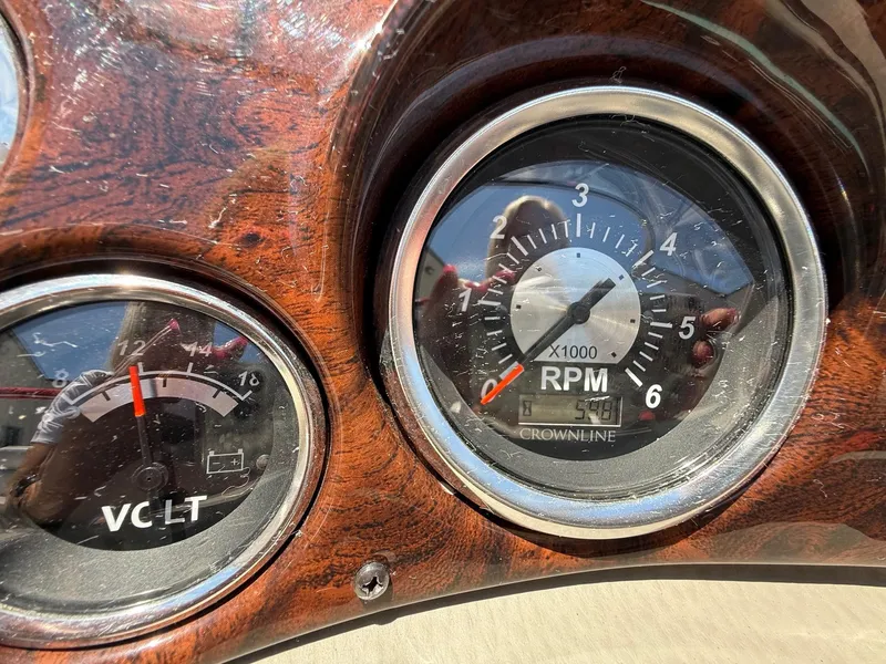 Slide: The Image of Close-up of 2012 Crownline 18 SS boat dashboard gauges, showing RPM and voltage. - 14