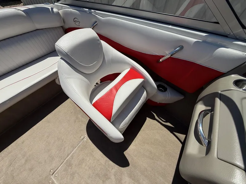 Slide: The Image of Interior of 2012 Crownline 18 SS boat with red and white seating. - 19