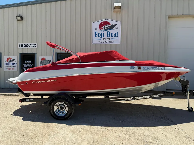 Slide: The Image of 2012 Crownline 18 SS boat in red, parked at Boji Boat Brokers. - 28