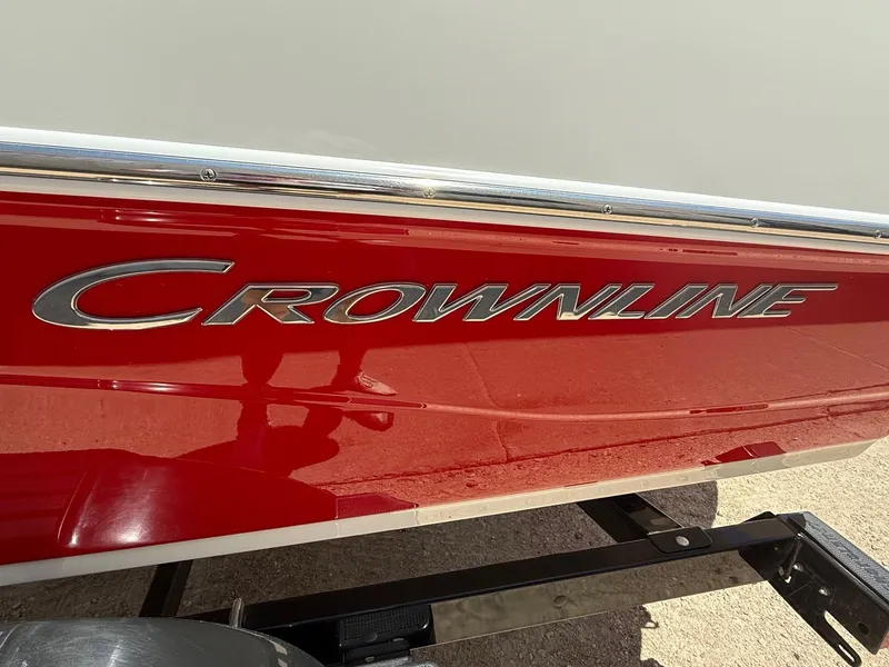 Slide: The Image of Red 2012 Crownline 18 SS boat with chrome logo on the side. - 4