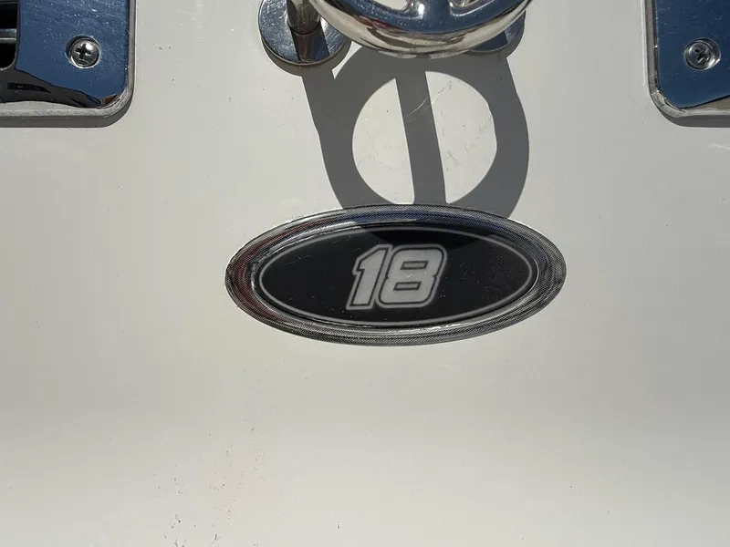 Slide: The Image of Crownline 18 SS 2012 model emblem on white surface. - 5