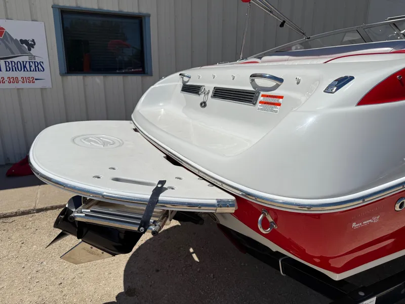 Slide: The Image of 2012 Crownline 18 SS boat rear view with swim platform and outdrive. - 7