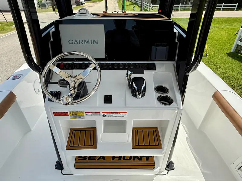 Slide: The Image of 2026 Sea Hunt BX 25 FS boat console with Garmin display and steering wheel. - 11