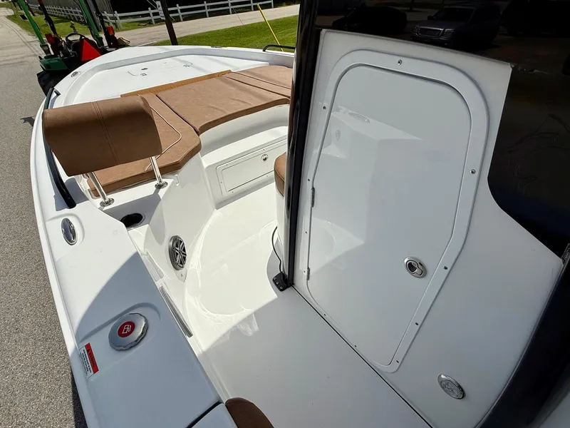 Slide: The Image of 2026 Sea Hunt BX 25 FS boat interior with seating and storage compartment. - 13