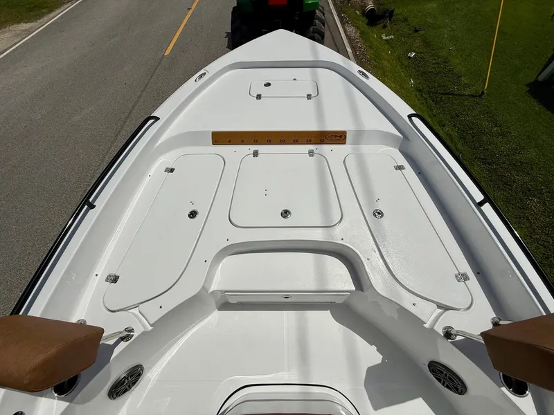 Slide: The Image of 2026 Sea Hunt BX 25 FS boat deck with storage compartments and seating. - 16