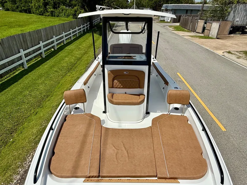 Slide: The Image of 2026 Sea Hunt BX 25 FS boat with tan seating and spacious deck. - 18