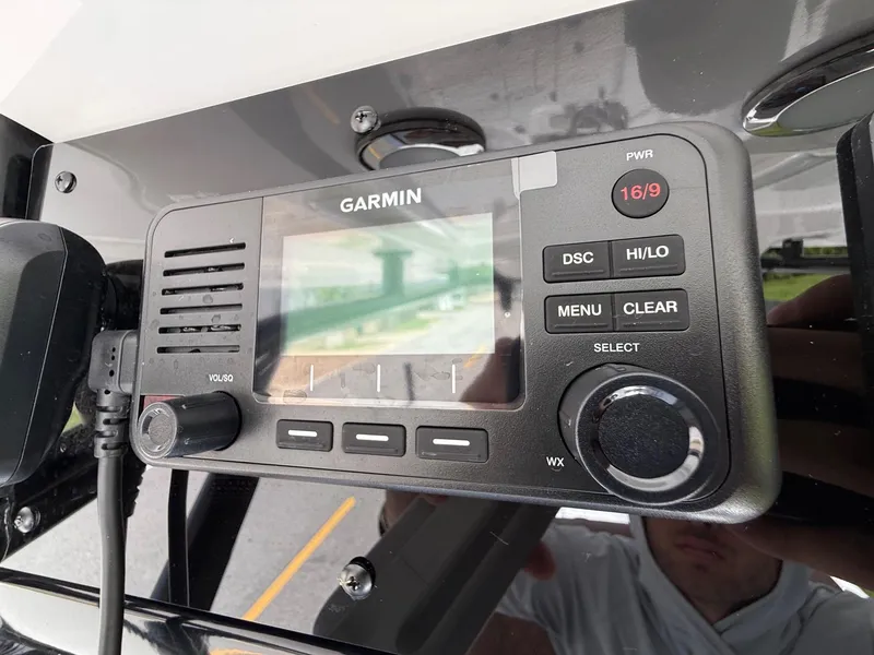 Slide: The Image of Garmin marine radio on 2026 Sea Hunt BX 25 FS boat dashboard. - 20
